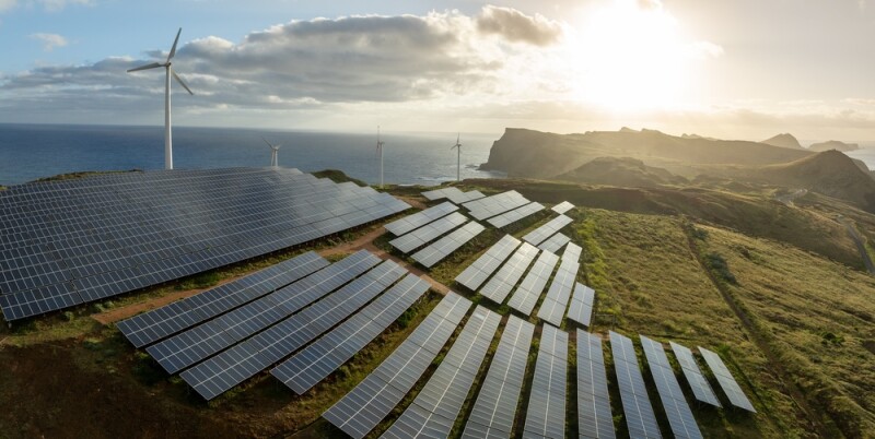 Solar energy panels photovoltaic cell and wind power plants on the seashore landscape for production of renewable green energy