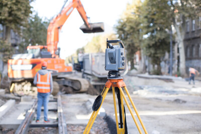 people and machines reconstructing a city street