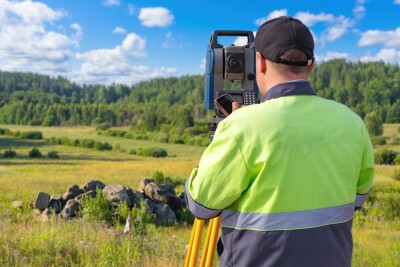 Man surveyor with his back to camera.