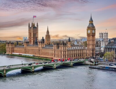 London cityscape with Houses of Parliament and Big Ben tower at sunset