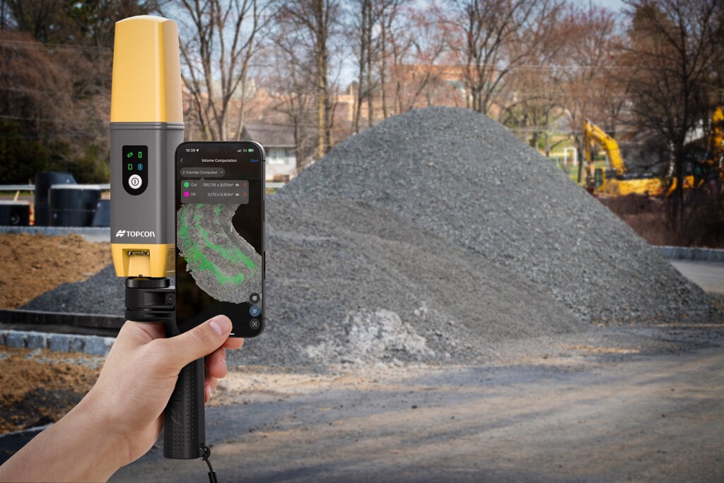 Topcon's CR-H1 being held in front of a gravel pile.