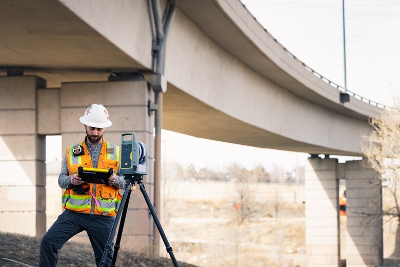 Worker standing next to Trimble laser scanner