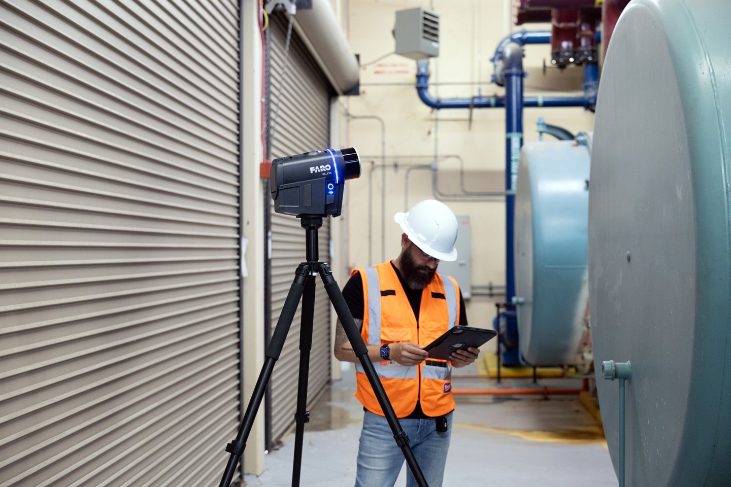 FARO Blink on a tripod with worker standing in the background