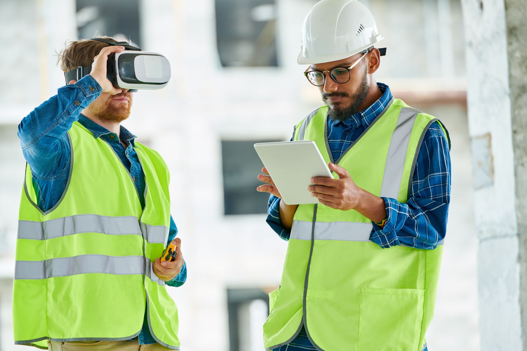 Construction workers on-site utilizing VR technology.