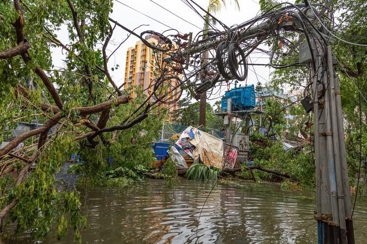 Kolkata, West Bengal, India, May 20, 2020: Severe cyclonic storm damage with broken electric pole with high voltage wire hanging dangerously at city residential area at Kolkata