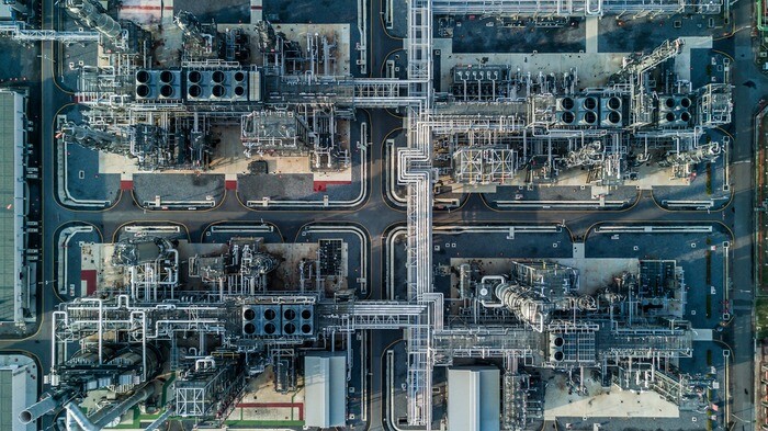 Aerial top view oil and gas refinery background, Business petrochemical industrial, Refinery oil and gas factory power and fuel energy, Ecosystem and healthy environment concepts.