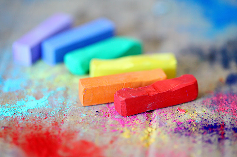 A collection of chalk sticks in every color of the rainbow