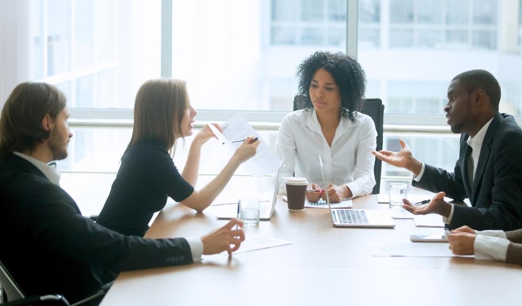 Colleagues sharing ideas in a meeting
