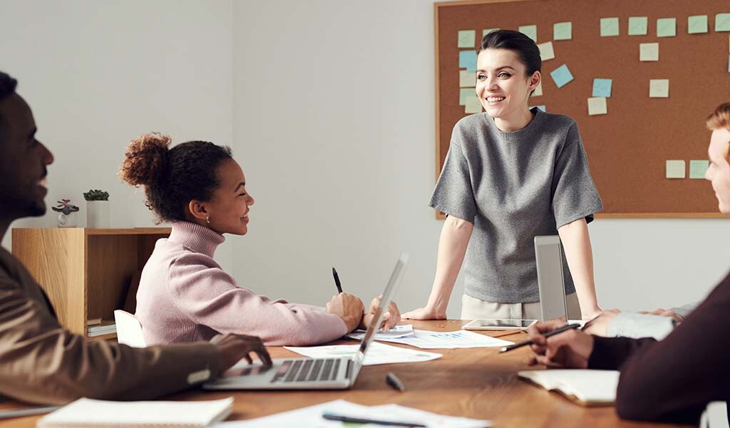Employees around a table doing project planning