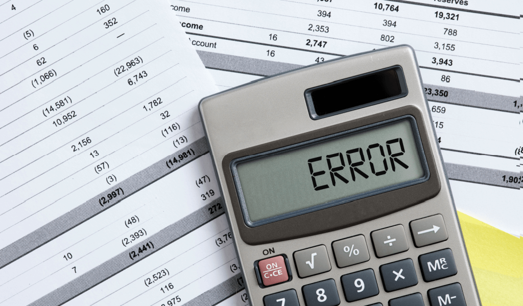 Calculator showing an error over financial statements