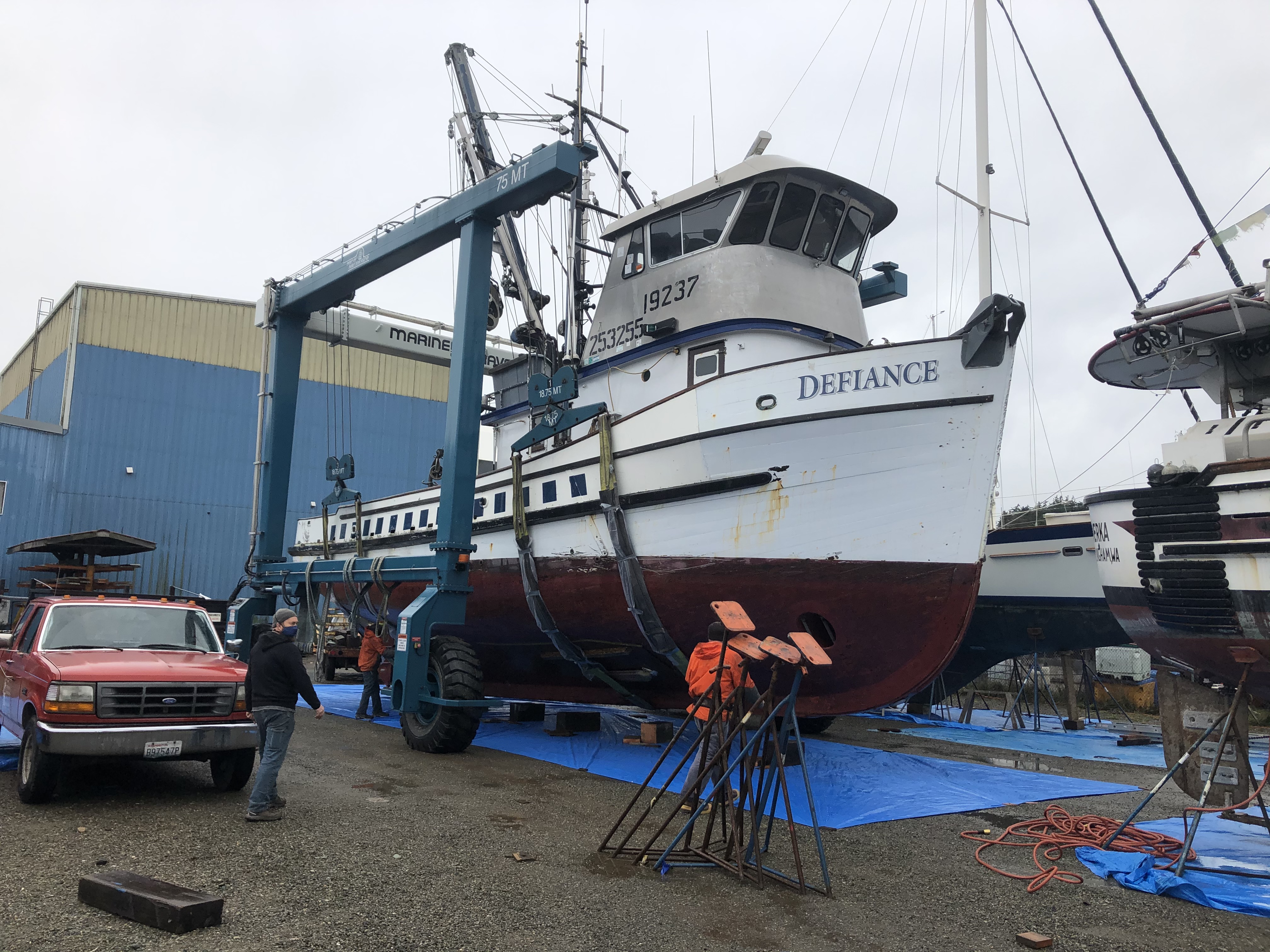 A Row of Large Fishing Vessel Boat Boats Docking Nearby the Fish