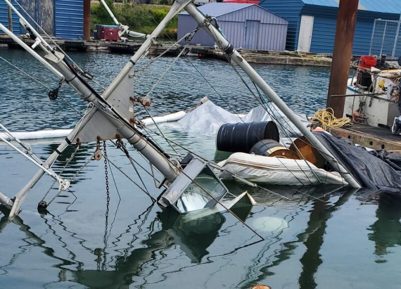 Troller sinks at the dock in Newport, Ore.