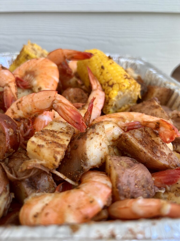 Lowcountry boil with shrimp, potatoes, corn, andouille sausage, and crab boil