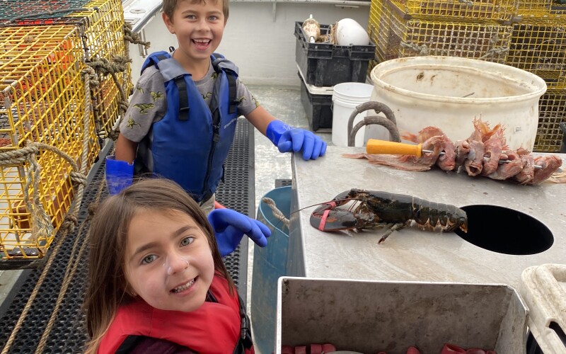 Curt Brown's children, Finn (8) and Clara (6) out lobstering on his boat, F/V Lil More Tail. Photo courtesy of Curt Brown.