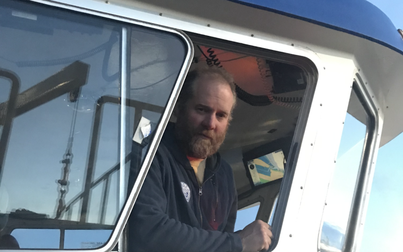 2023 National Fisherman Highliner, Matt Alward in the window of his fishing vessel.