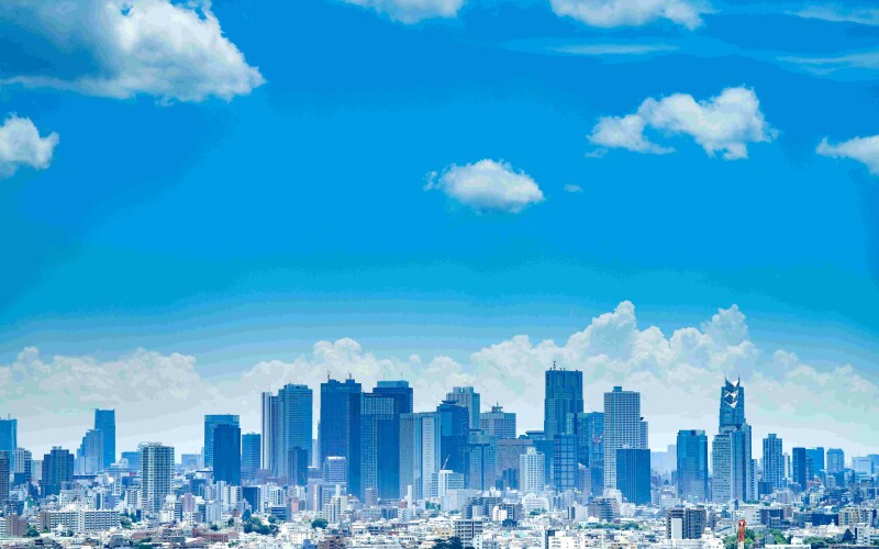 Skyline view of city with blue sky. Prime minister Fumio Kishisa ate seafood sourced from the sea off Fukushima