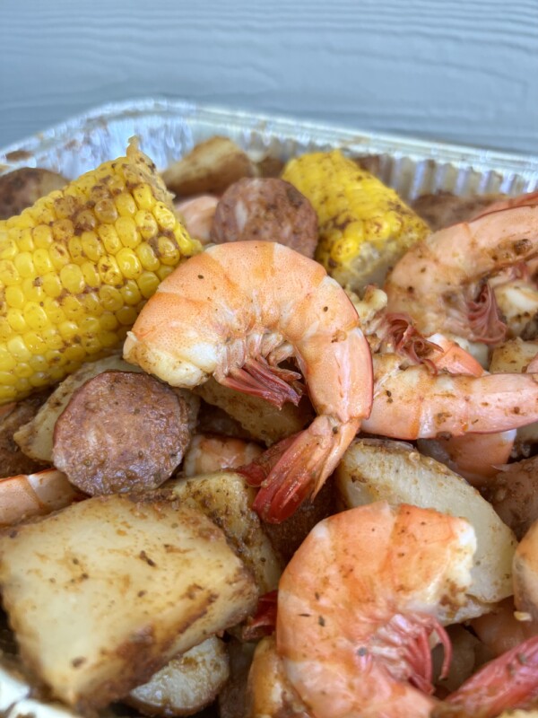 Lowcountry boil with shrimp, potatoes, corn, andouille sausage, and crab boil