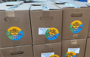 USDA food boxes featuring the USDA sticker.