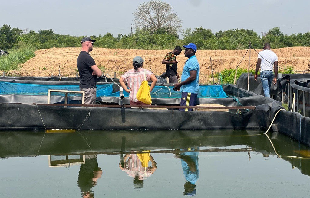 ASC employees working in Ghana at a fishery