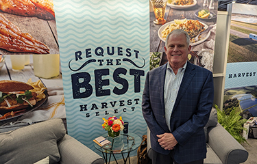 Harvest Select CEO Randy Rhodes inside the company's booth at Seafood Expo North America.