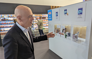 Vičiūnai Group Director Juan Guitart Fernandez showing off the company's multiple Seafood Expo Global awards.