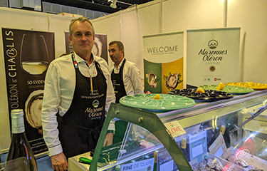 Nicolas Brossard poses in the Marennes Oleron booth at Seafood Expo Asia.