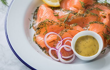 Norwegian samlon on a plate with onions