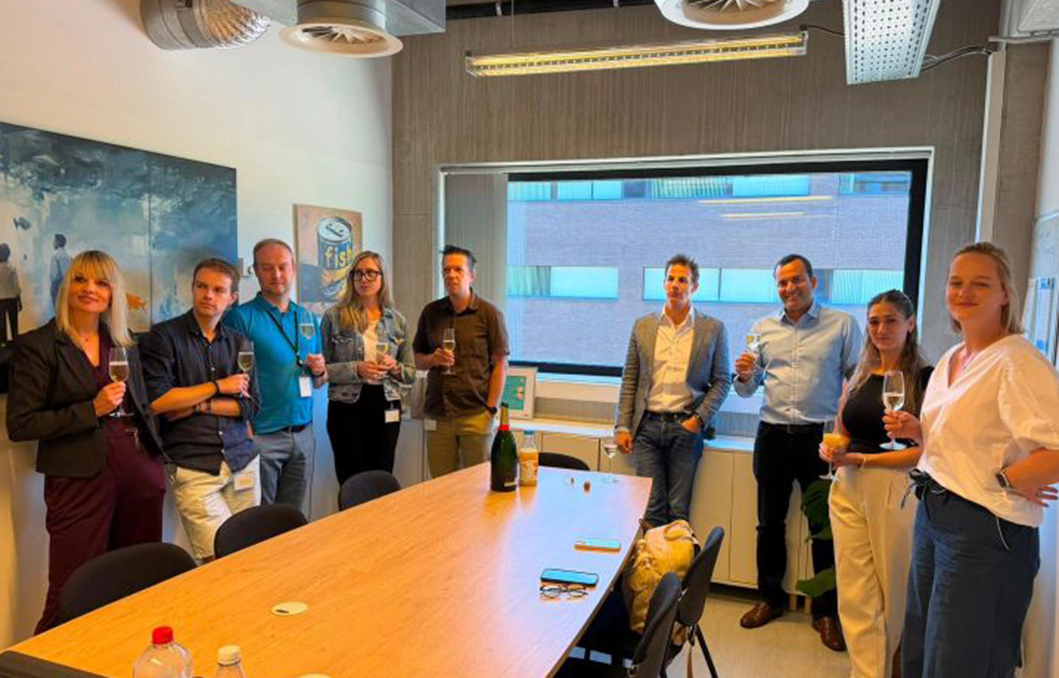 Employees with Ever After Foods and Fishway celebrate the two companies' merger