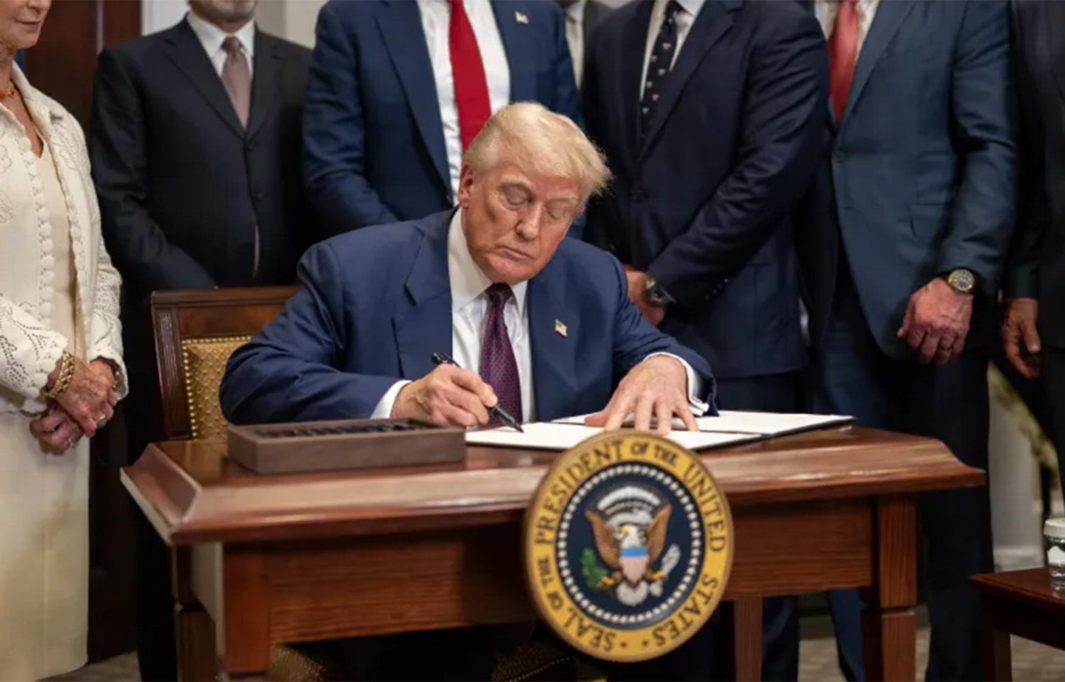 U.S. President Donald Trump signing an executive order