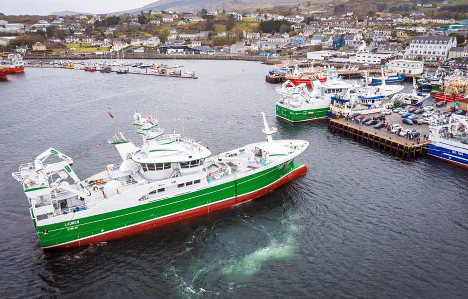 A fishing vessel pulls into the harbor in Killybegs, Ireland