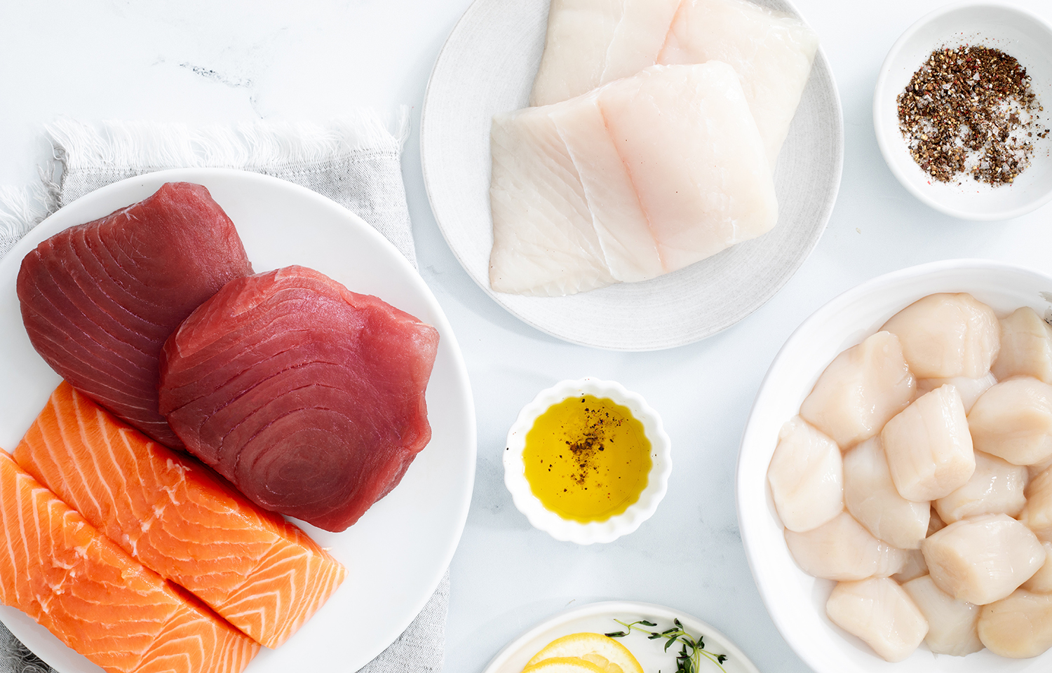 An array of Fulton Fish Market offerings, such as tuna, salmon, and scallops
