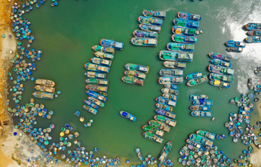A fleet of fishing boats sitting idle in Vietnam.