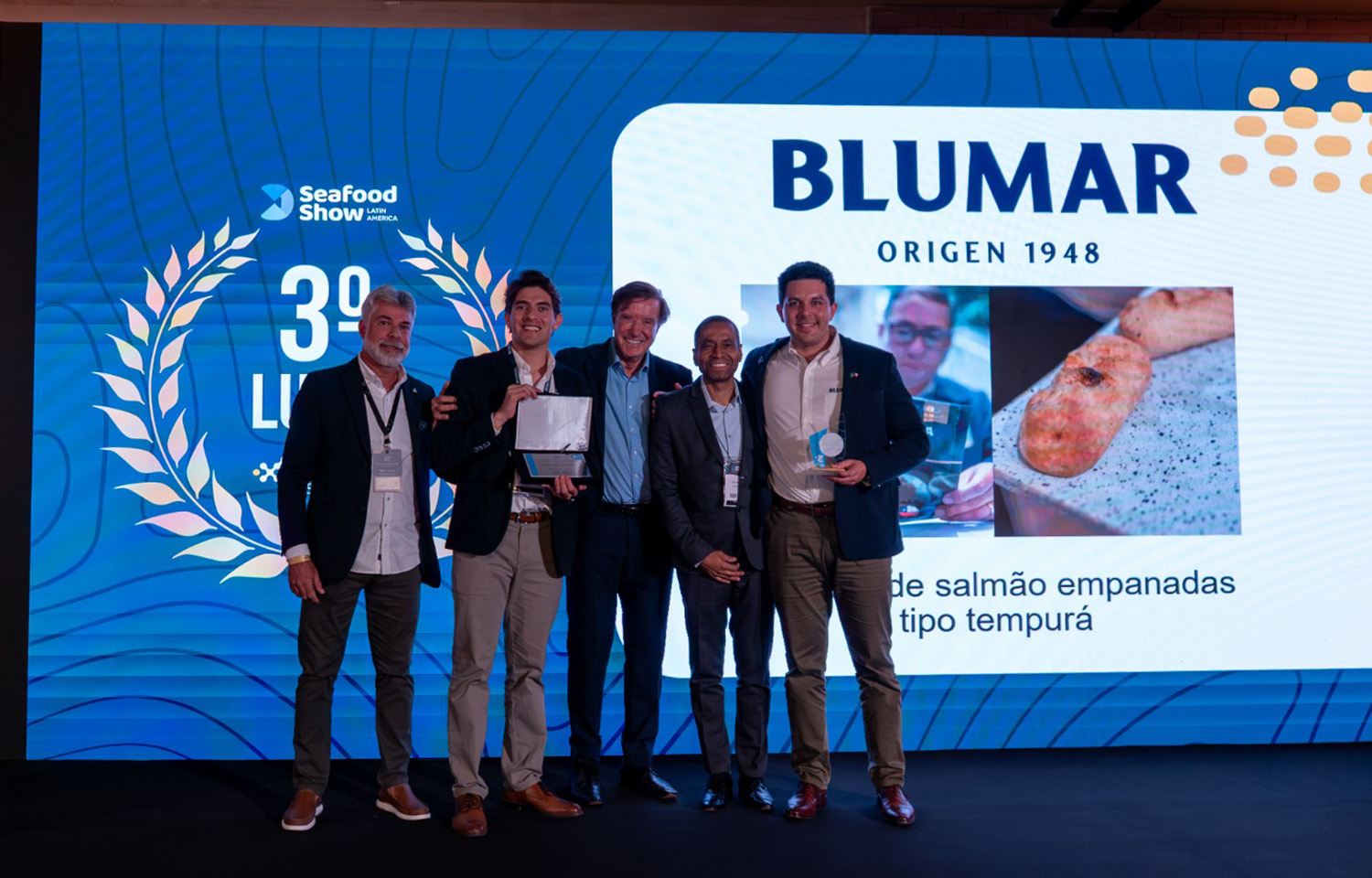 Blumar representatives celebrating their third place win at the 2025 Seafood Innovation Show in São Paulo, Brazil