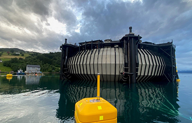 Bluegreen Group's "Marine Donut" aquaculture enclosure concept floating in the water.
