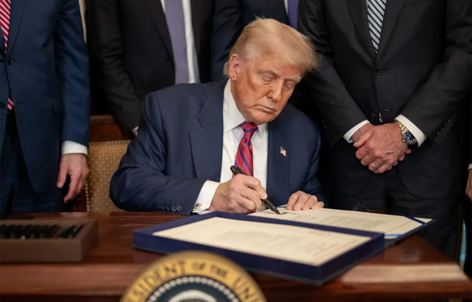 U.S. President Donald Trump signing an executive order