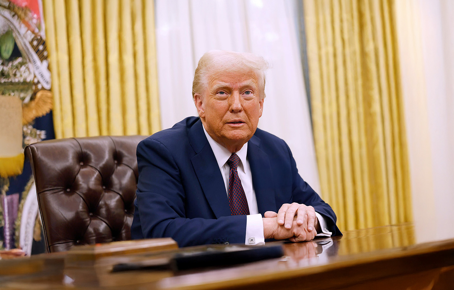 U.S. President Donald Trump at his desk in the Oval Office