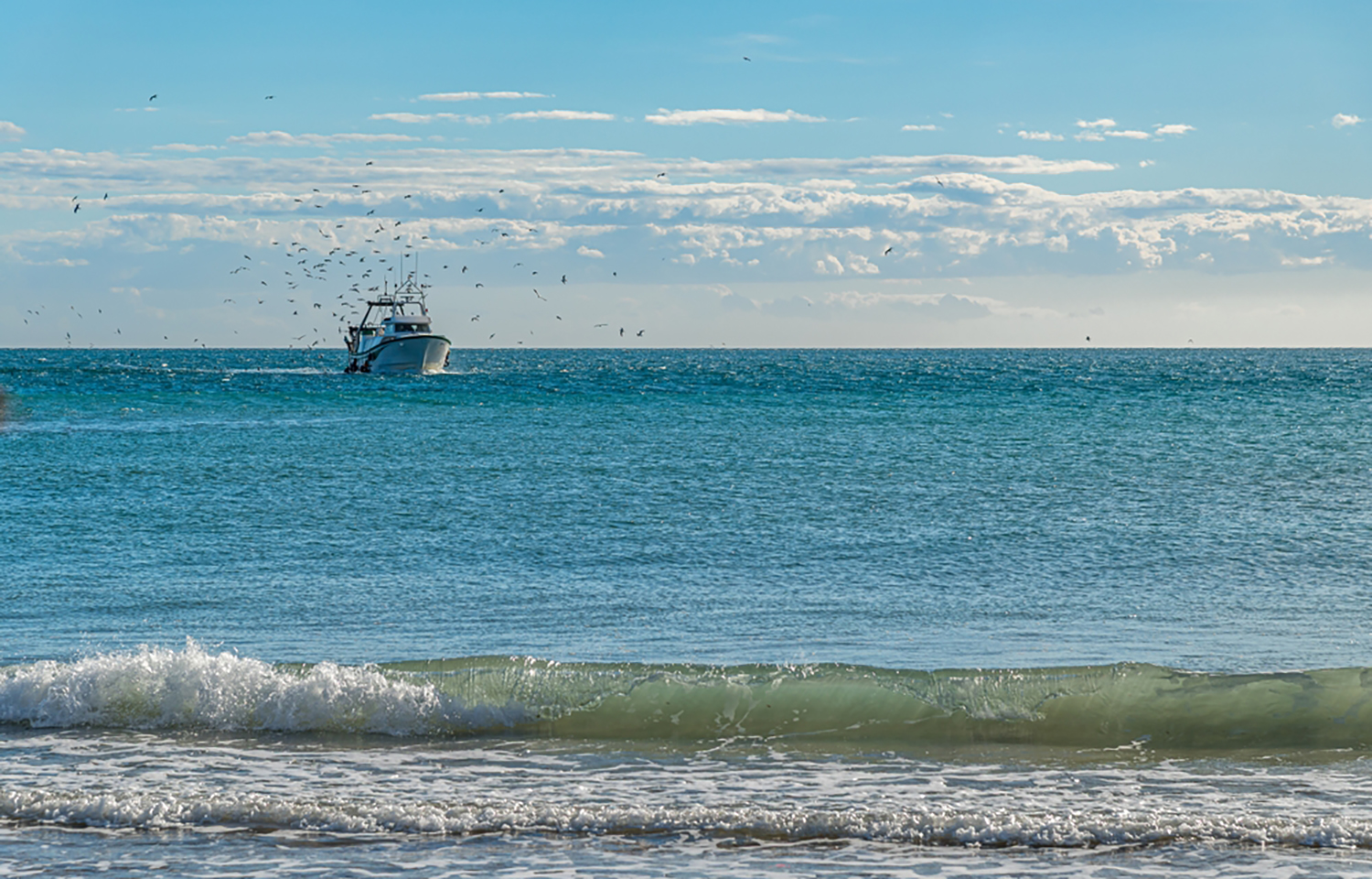 A fishing boat off the coast of Villajoyosa, Spain