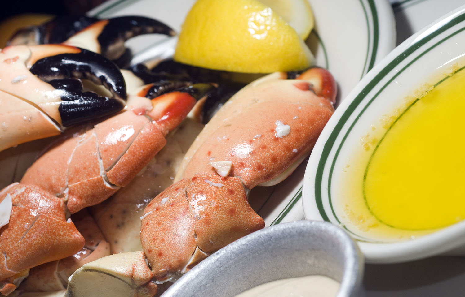 Stone crab claws on a plate with butter