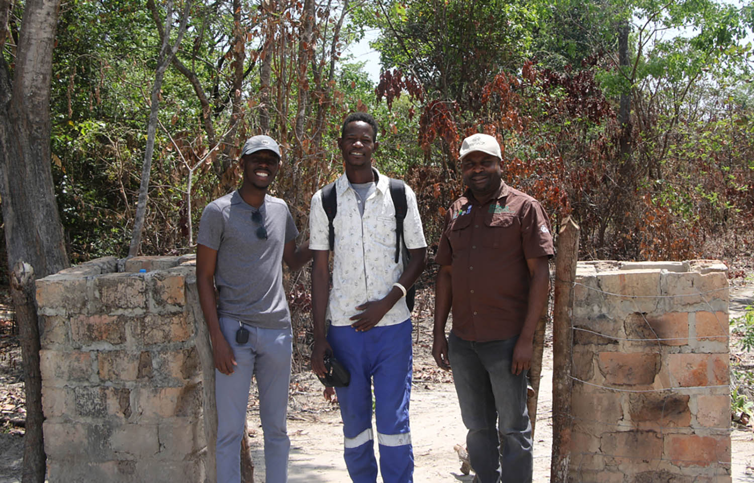 Zambian aquaculturist Aubrain Lyavuka (middle) has completed OYA's aquaculture training and established his own farm