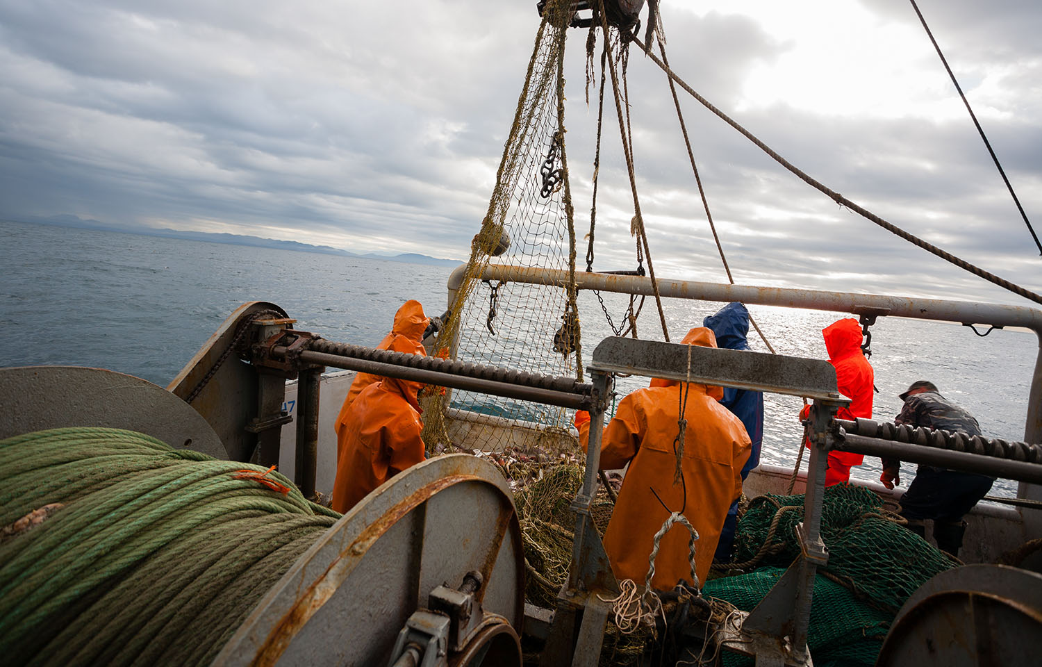 Fishermen onboard a commercial fishing vessel