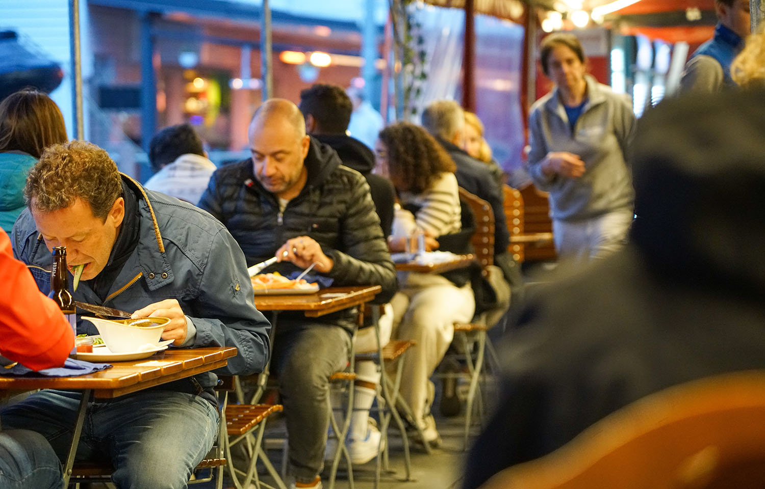 People in Bergen, Norway, eating at a seafood market