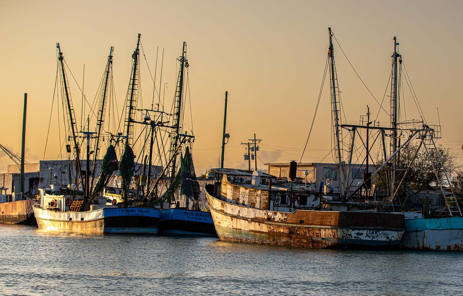 A row of fishing boats at a dock in Texas