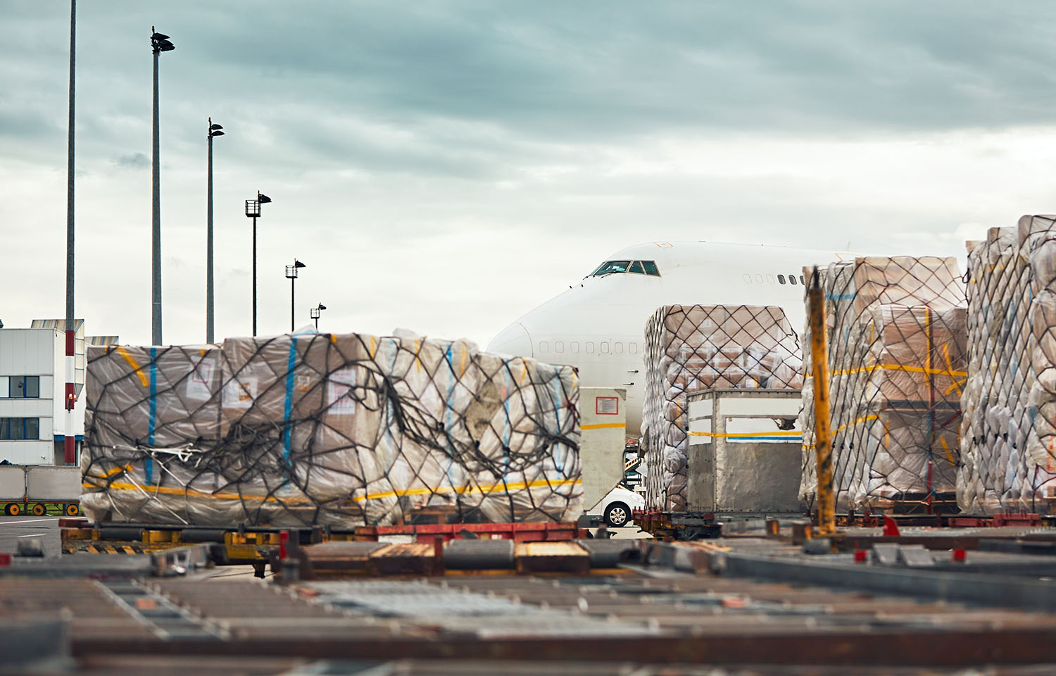 A plane being loaded with air freight at an airport