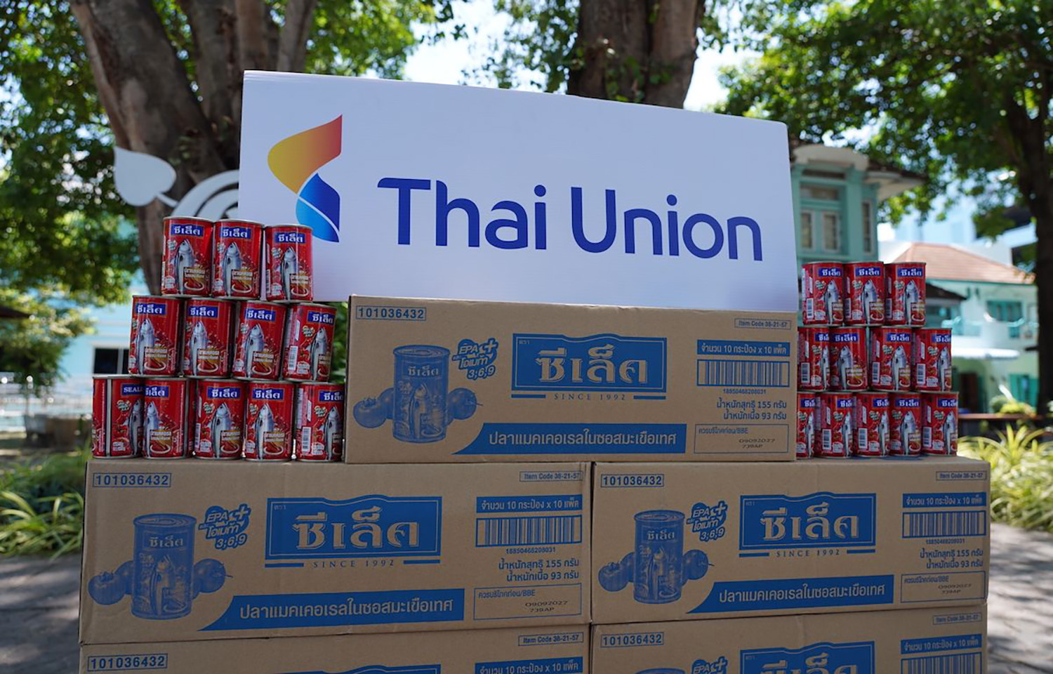 A pile of canned fish under a Thai Union sign