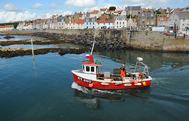 A U.K. fishing boat on the water.