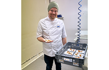 A Seabed Innovation employee showing off some of the sea urchin roe the company has harvested.