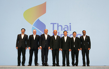 Thai Union executives standing on stage at an event.