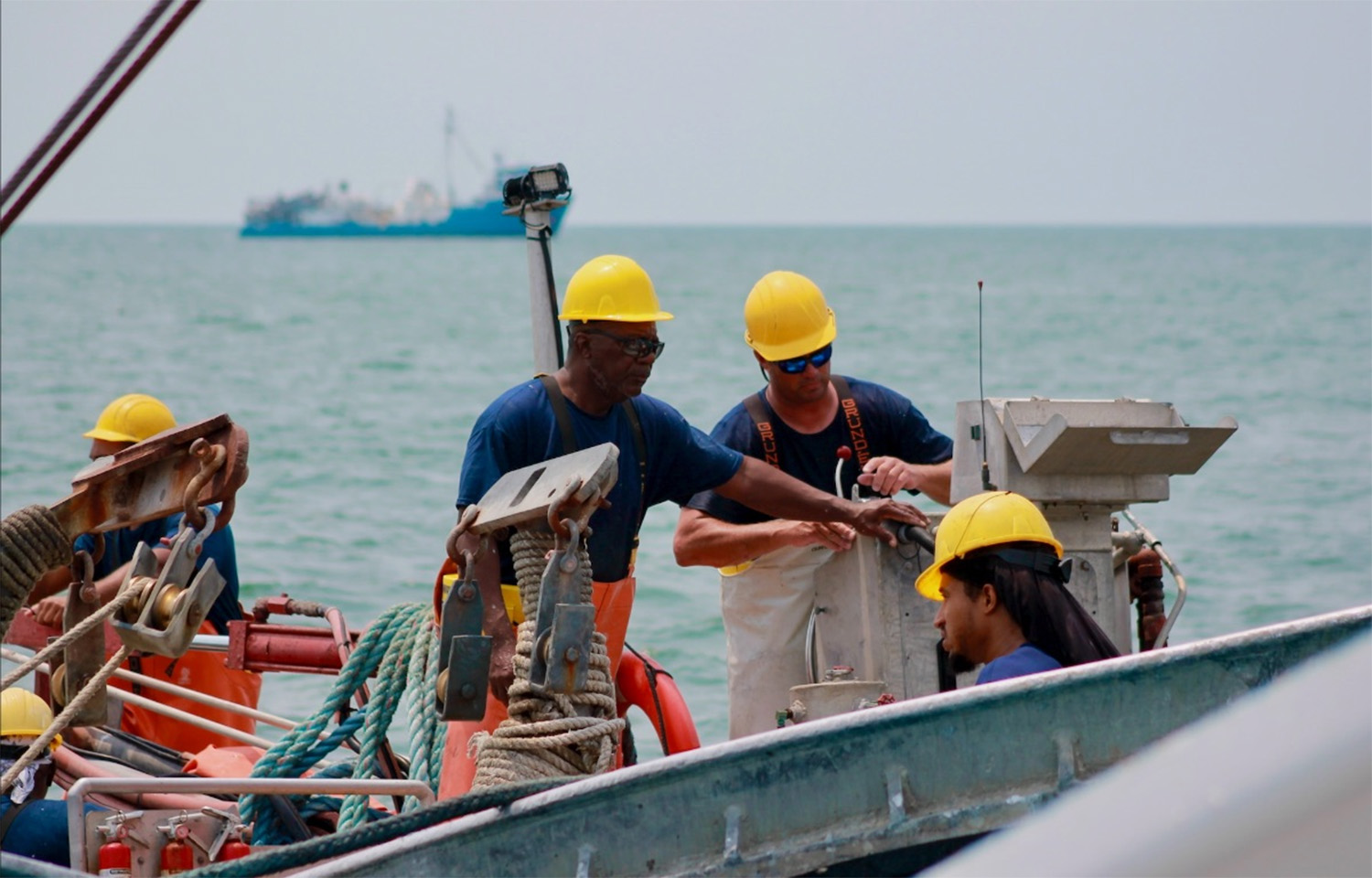 Workers with Ocean Harvesters on board a fishing vessel
