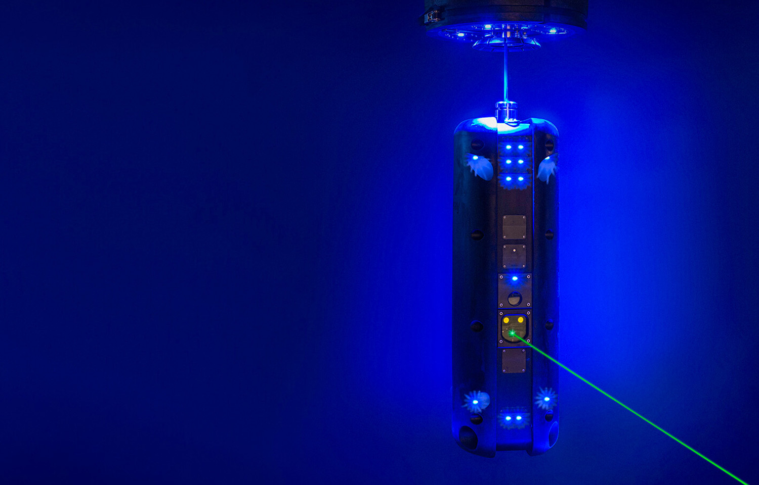 Stingray Marine Solutions' sea lice laser robot underwater shooting a green laser
