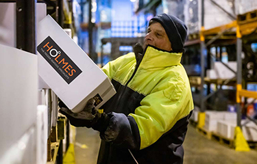 A Holmes Seafood employee at work.